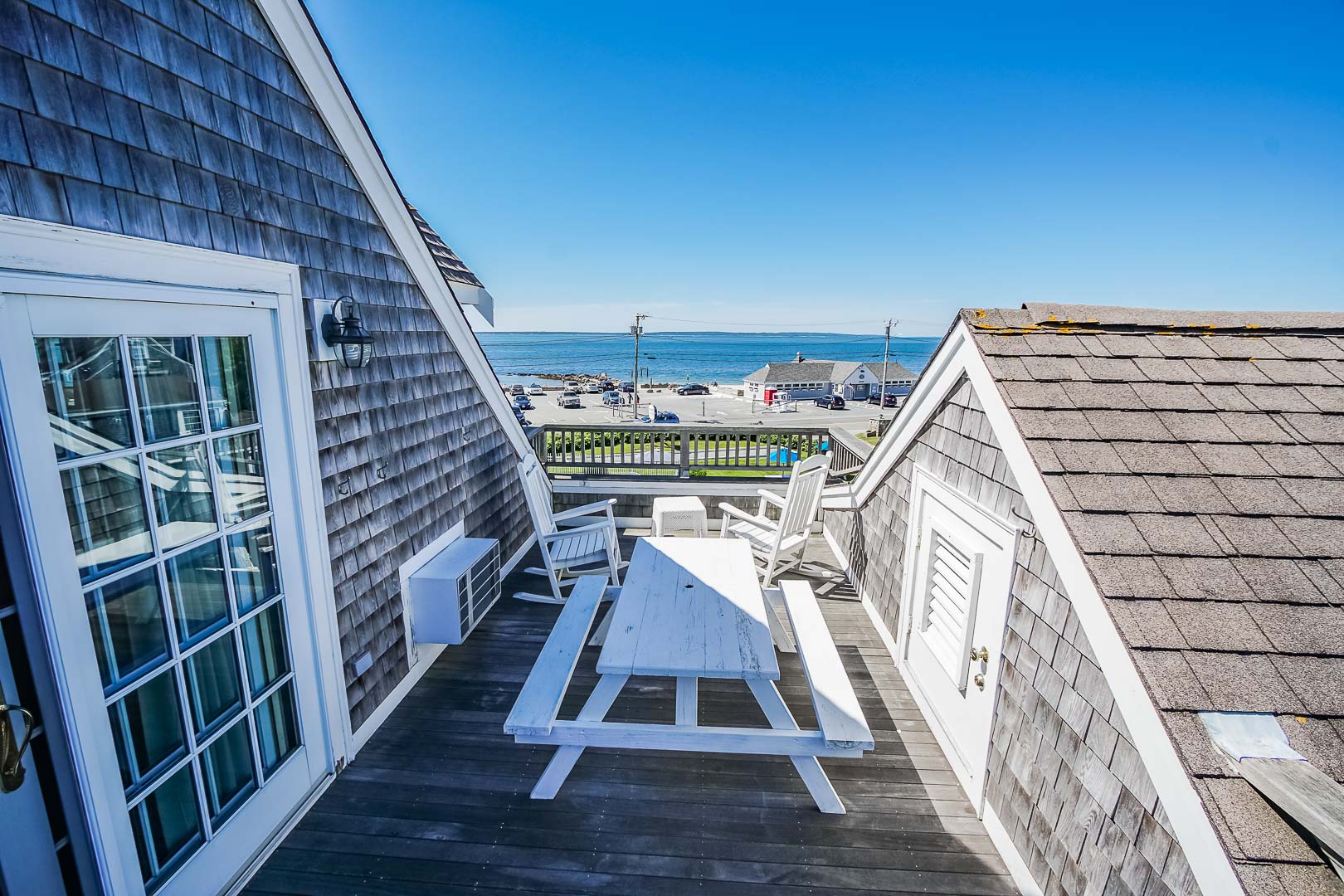 A serene beach view from the balcony at VRI's Beachside Village Resort in Massachusetts.